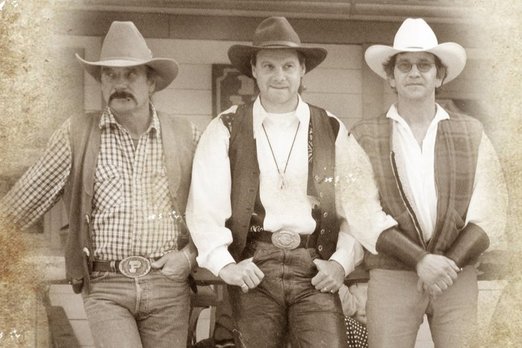 Drei Männer in Westernkleidung